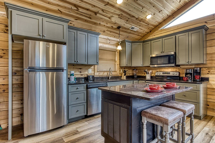 Kitchen in a log cabin managed by iTrip Smoky Mountains in Gatlinburg, Tennessee